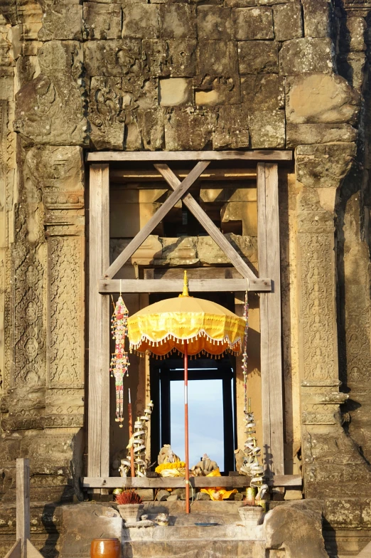 an outdoor area with a gold umbrella