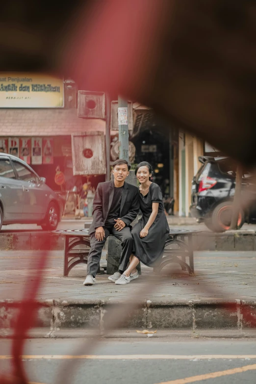 an image of a couple sitting on the bench