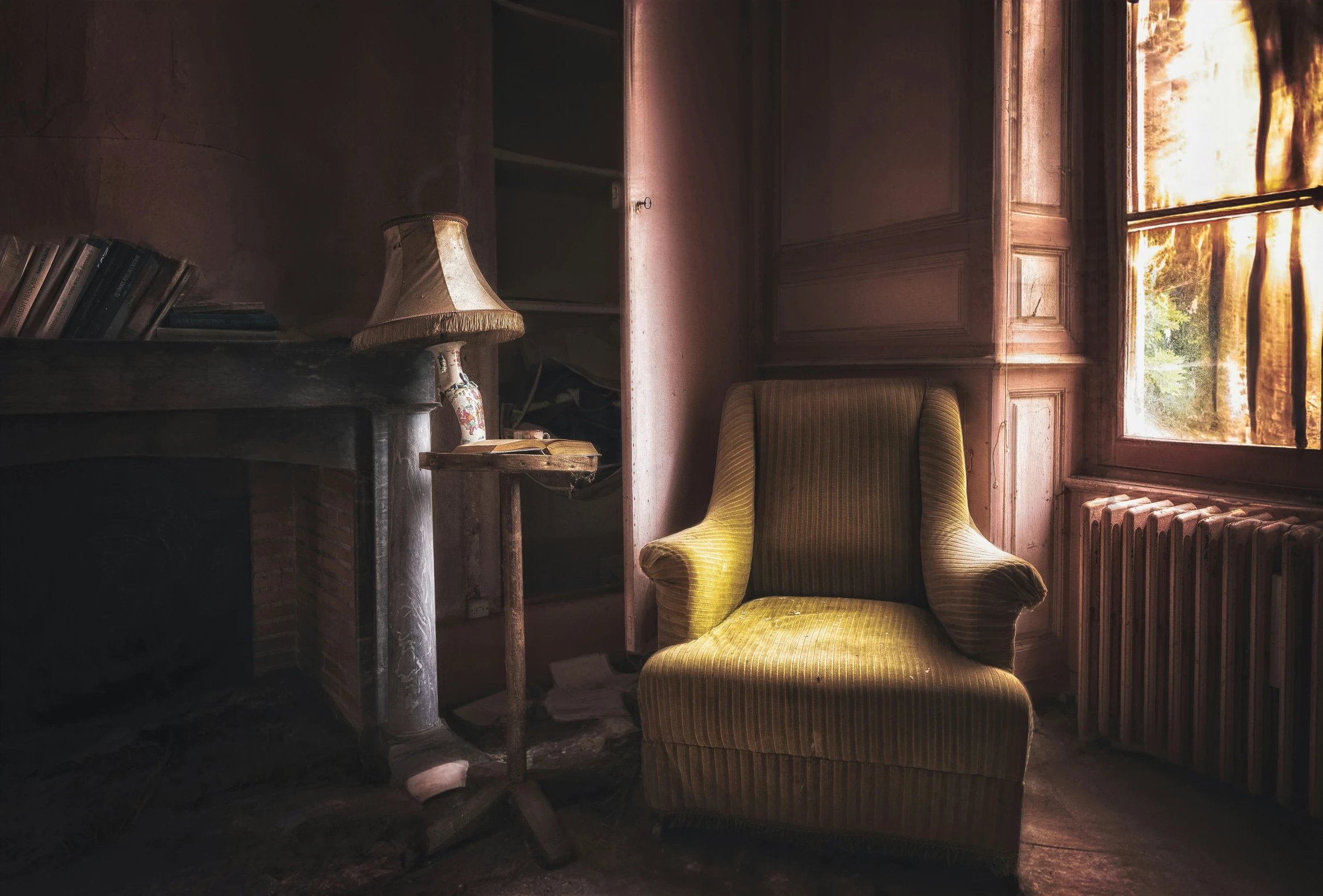 a chair in a room by a window and a fire place