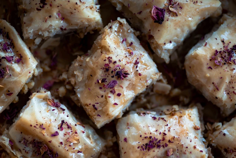 a close up of a square dessert with chocolate sprinkles