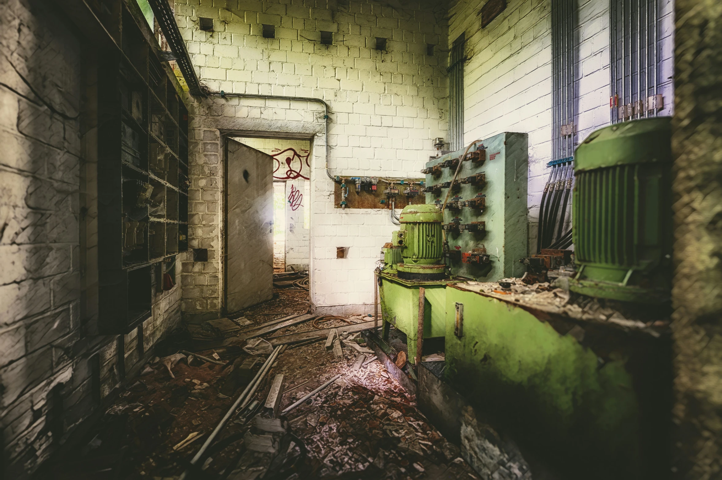 an industrial building with several doors and some windows