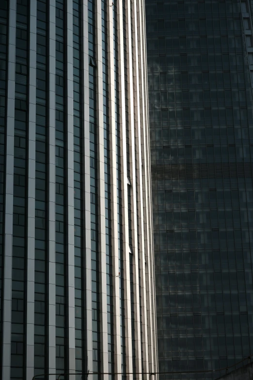 a tall building with lots of windows next to a traffic light