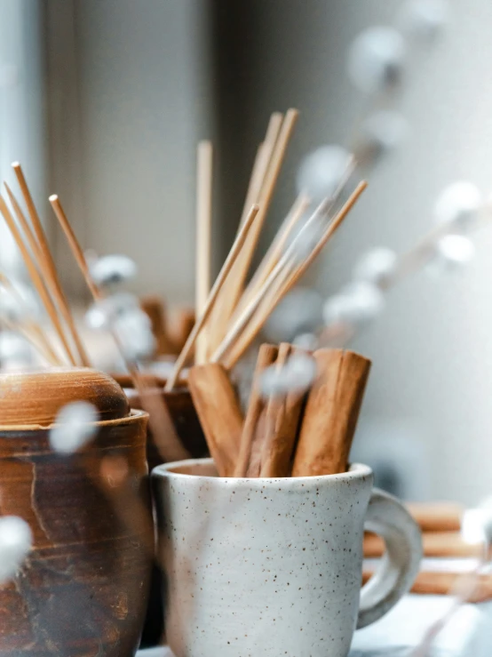 close up of cup and spoon with tea strainer