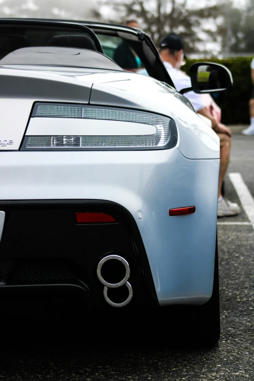 the back end of a sports car on a parking lot