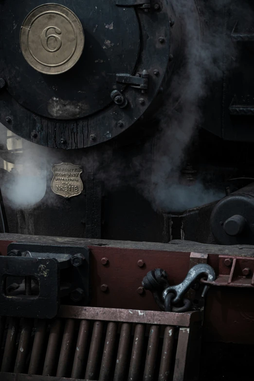 a steam locomotive is running on it's side