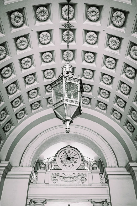 a clock that is hanging on the ceiling