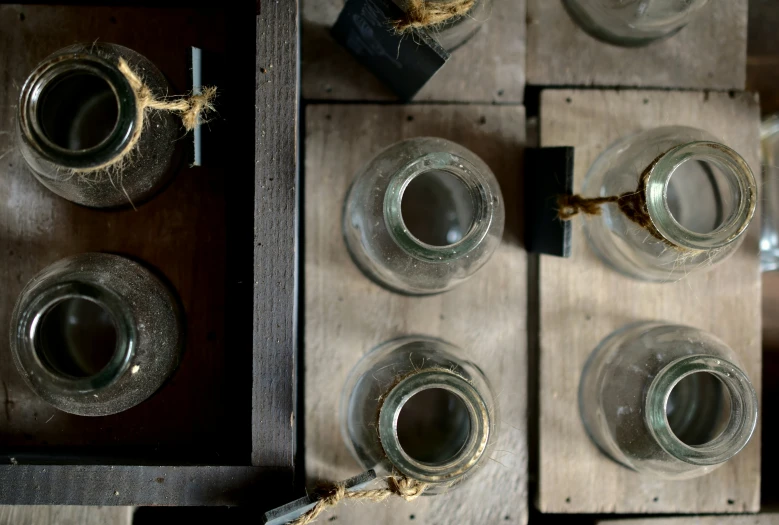 several different sized jars sitting in a box