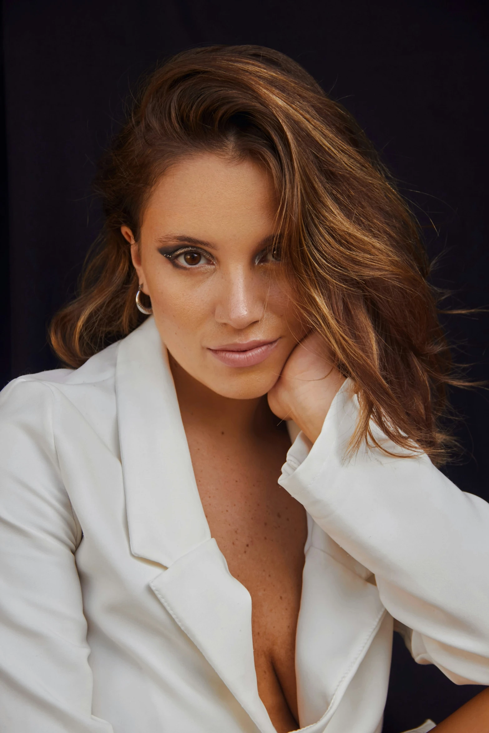 a beautiful woman with  and shirt in white posing for the camera