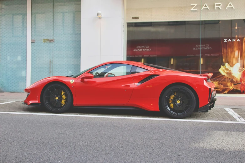 a red sports car parked in a parking space