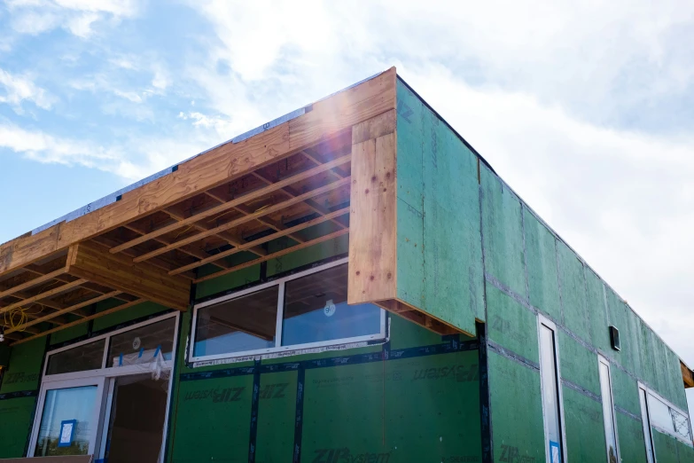 a house under construction with the front half covered up