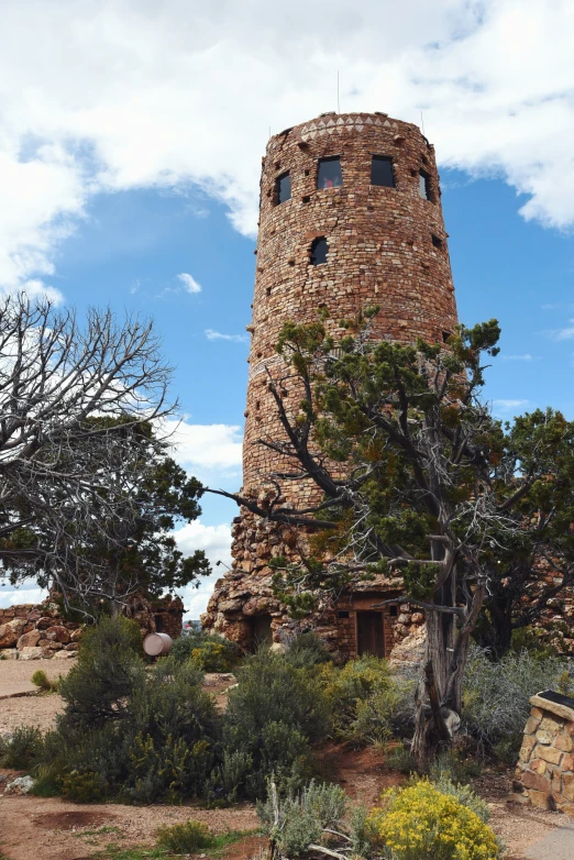 a stone tower with a clock on top