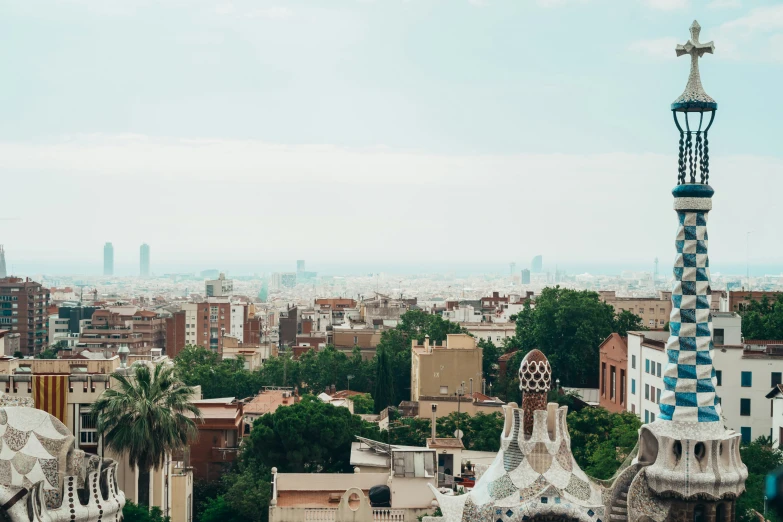 the city skyline is in view and with the roof of some buildings painted blue and white