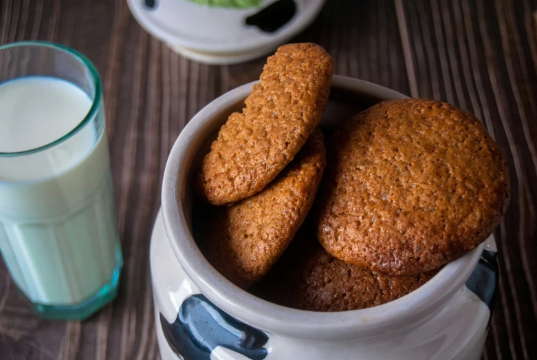 several cookies and milk on a table