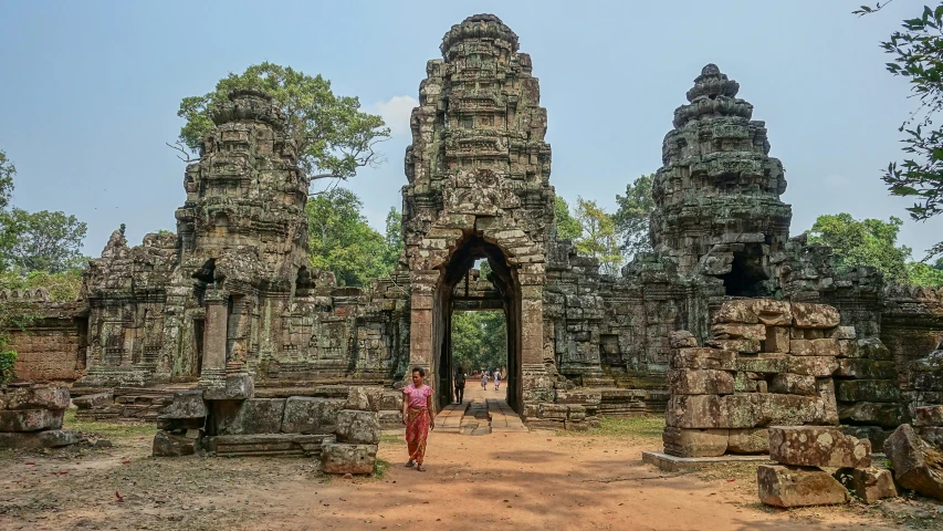 a person standing in front of some towers with no people