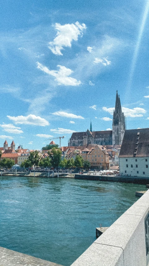 a view of the city is seen through the bridge