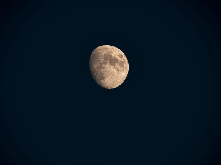 the moon looks like a dark side of space