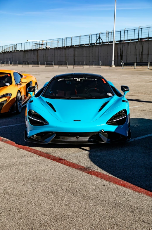 two cars side by side parked in a parking lot