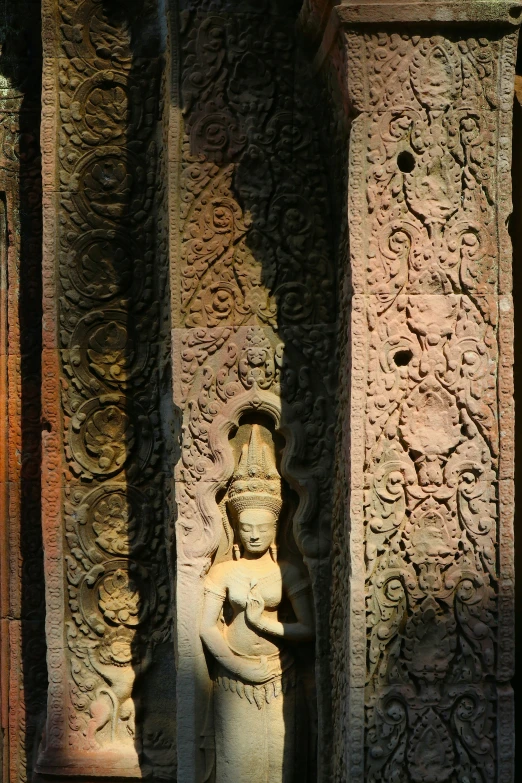 a stone statue is shown in a window