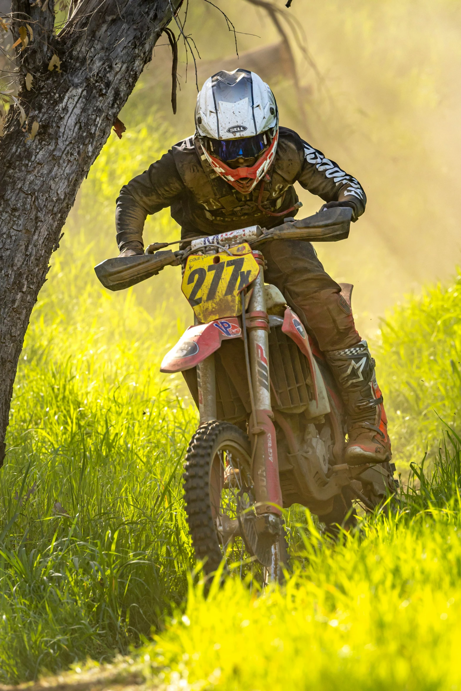 a person riding on a dirt bike on a field