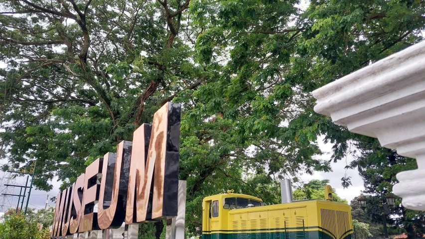 there is a truck on a display and trees