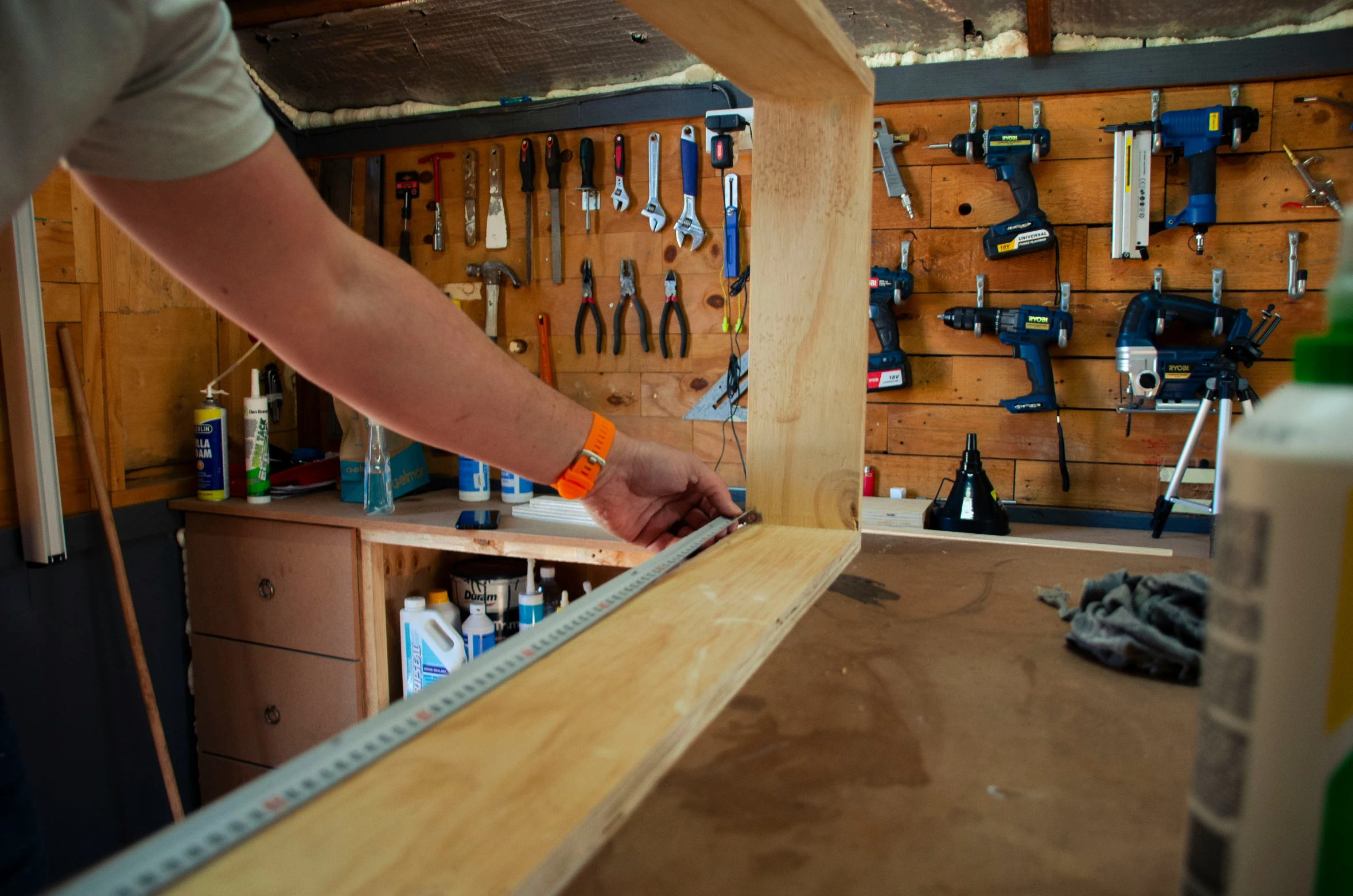 a person working on a piece of furniture