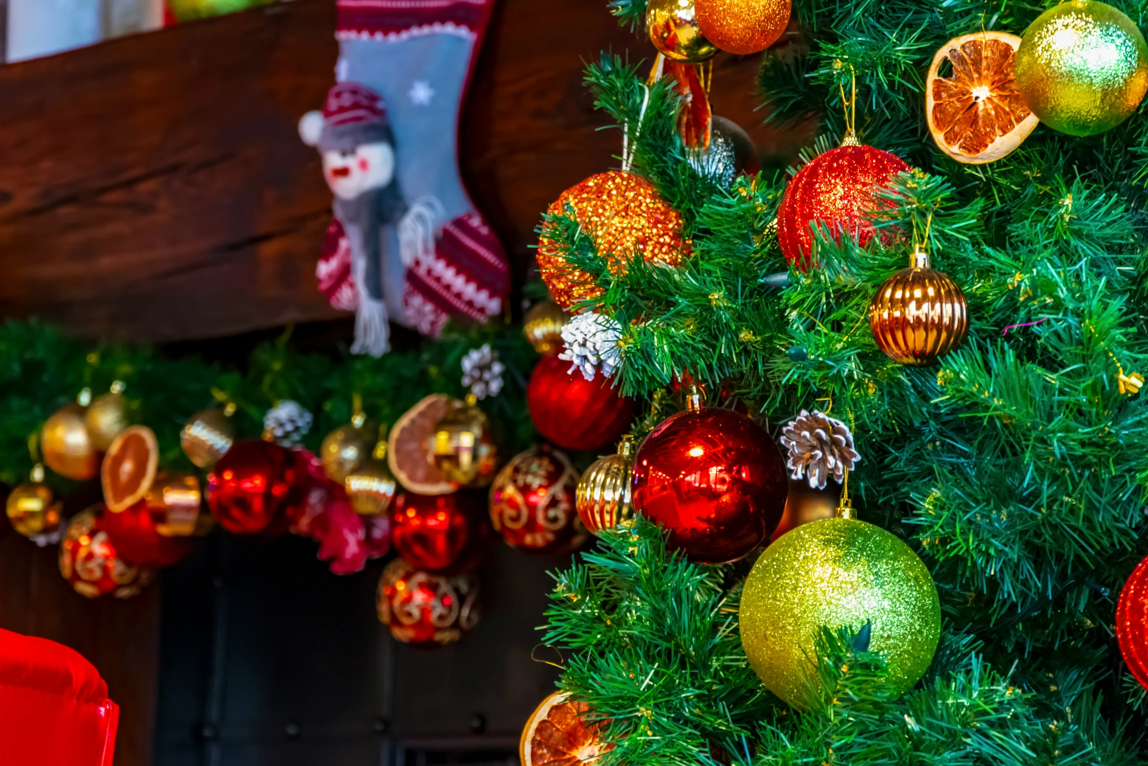 a small christmas tree decorated with shiny ornament ornaments