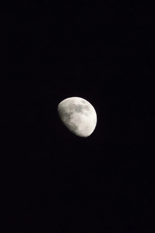 a black and white po of the moon and the sky