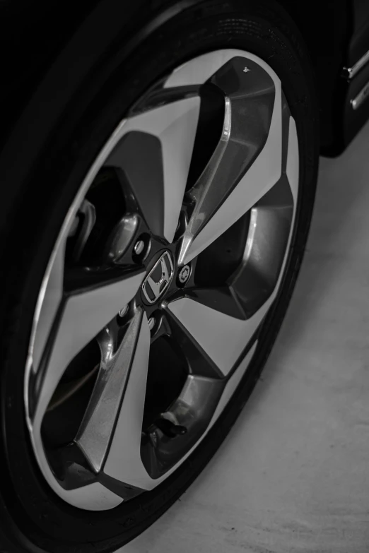 the center wheel and rims on a compact sedan