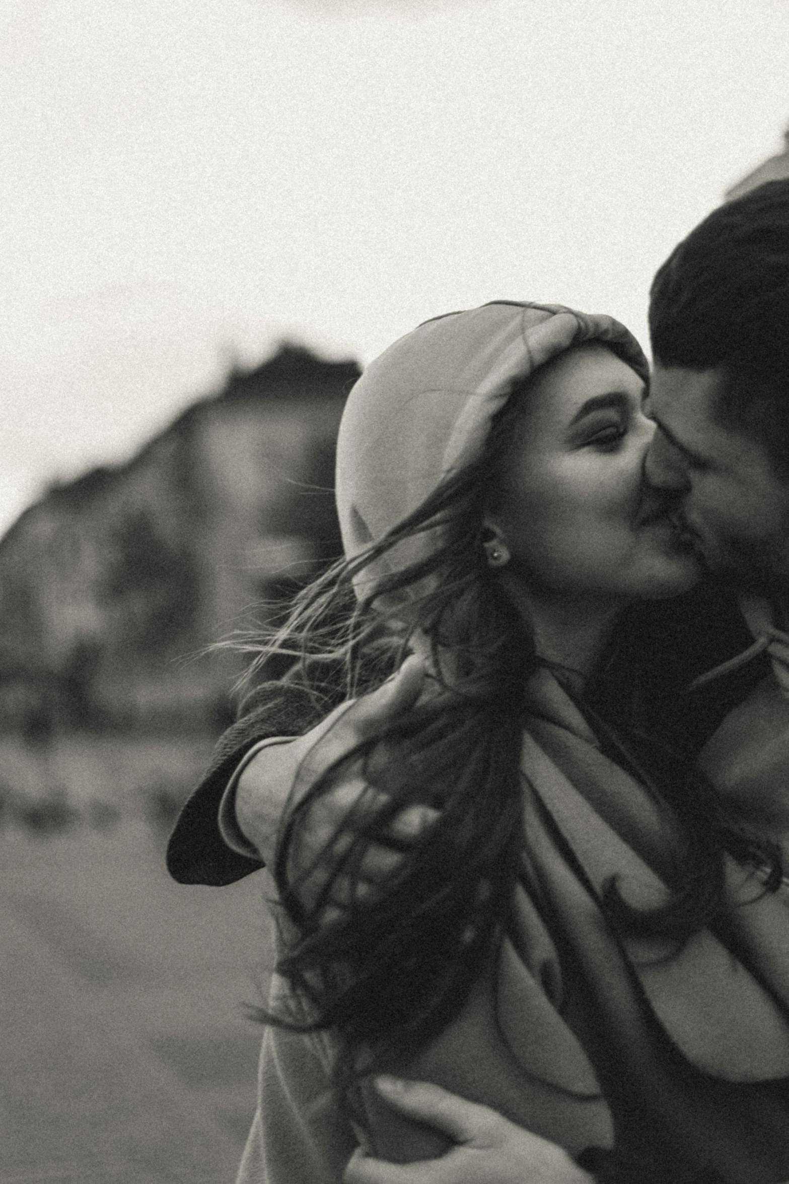 a young couple kissing in the middle of the street