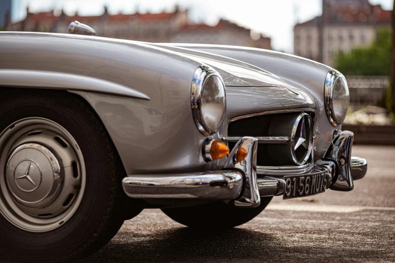 an old car is parked in a parking lot