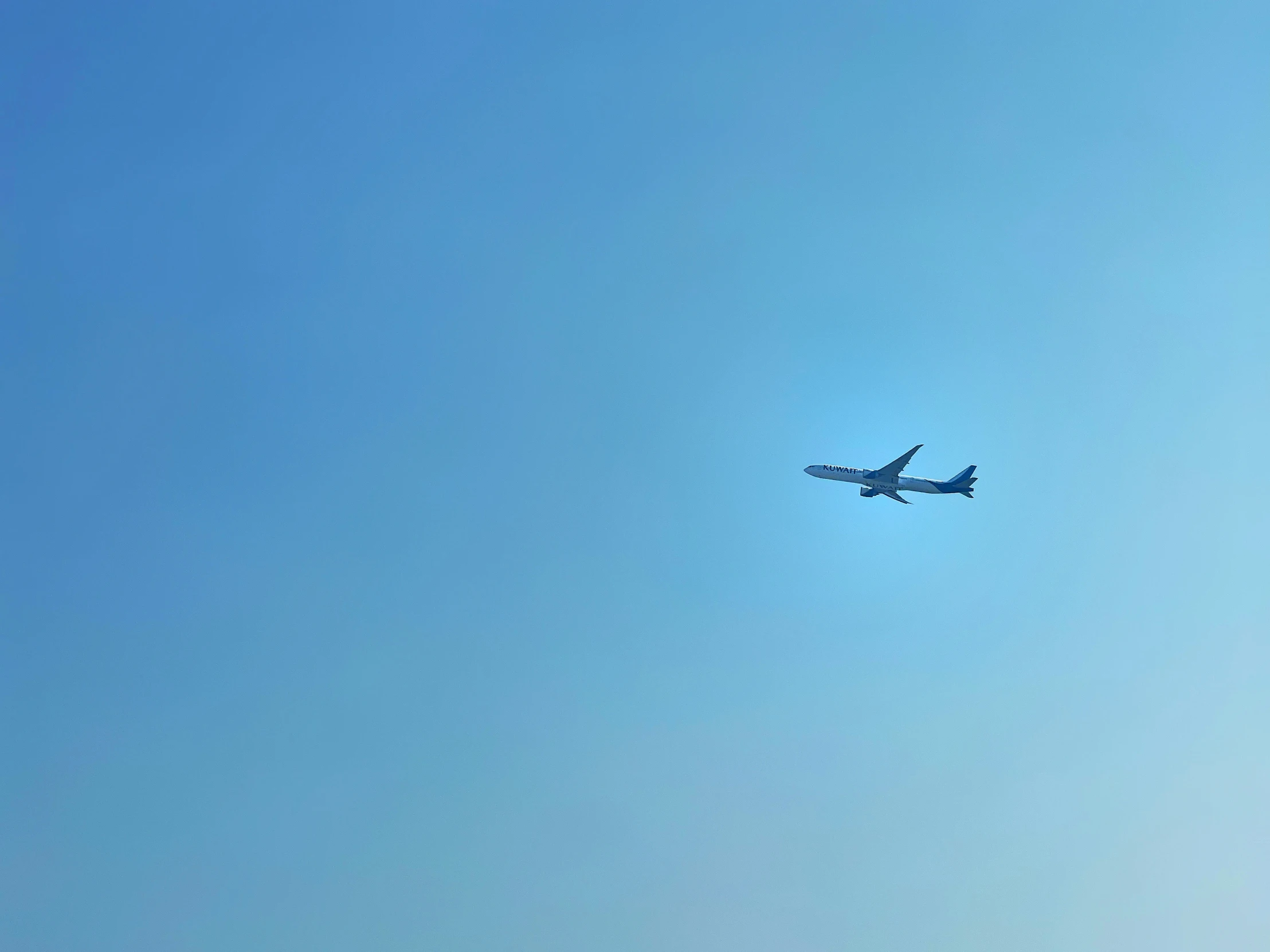 an airplane is in the sky and the sun shines on the bottom