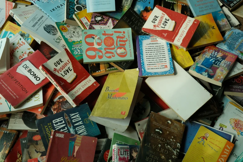 an assortment of books scattered together