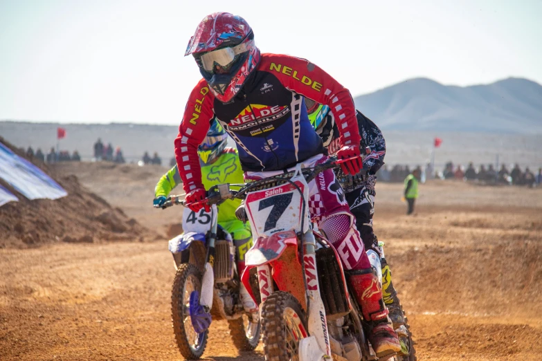 a man riding on the back of a dirt bike