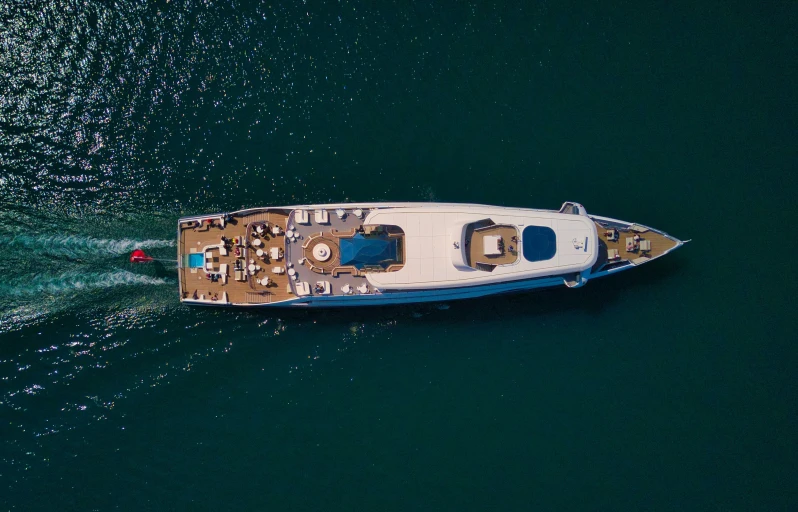 a large white boat is on clear water