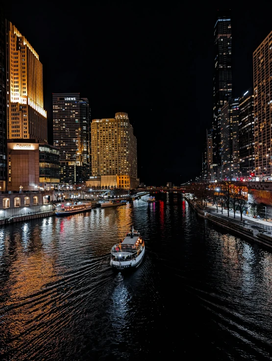 a river running through a big city at night