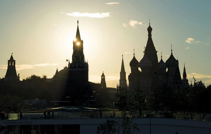 the sun shines in between many spires in this historical area