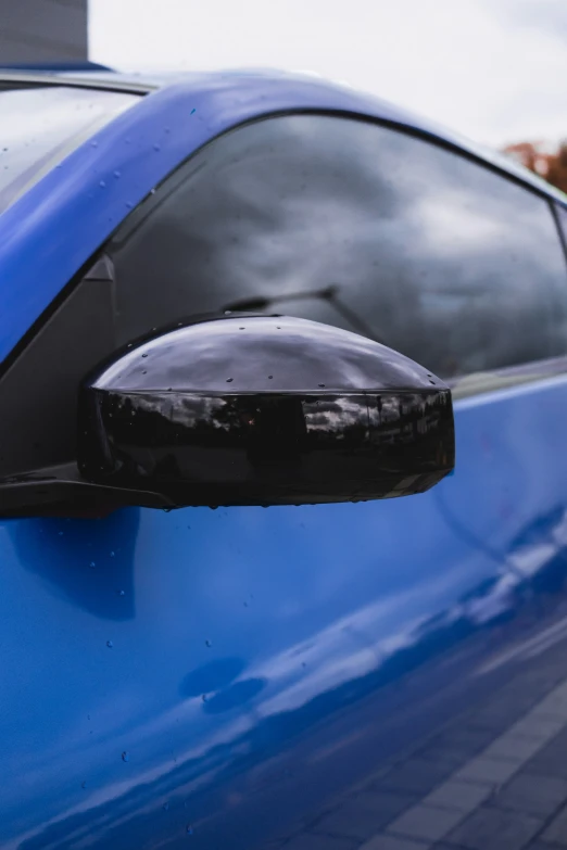 close up view of the wing mirror and black trim