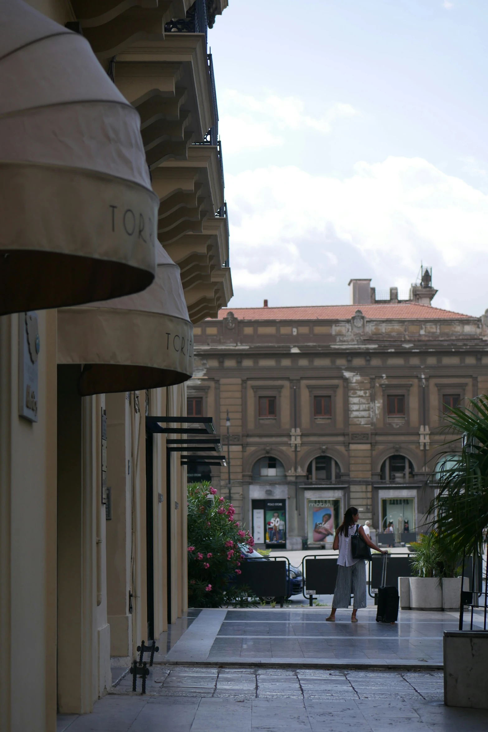 a woman standing on the outside of a building