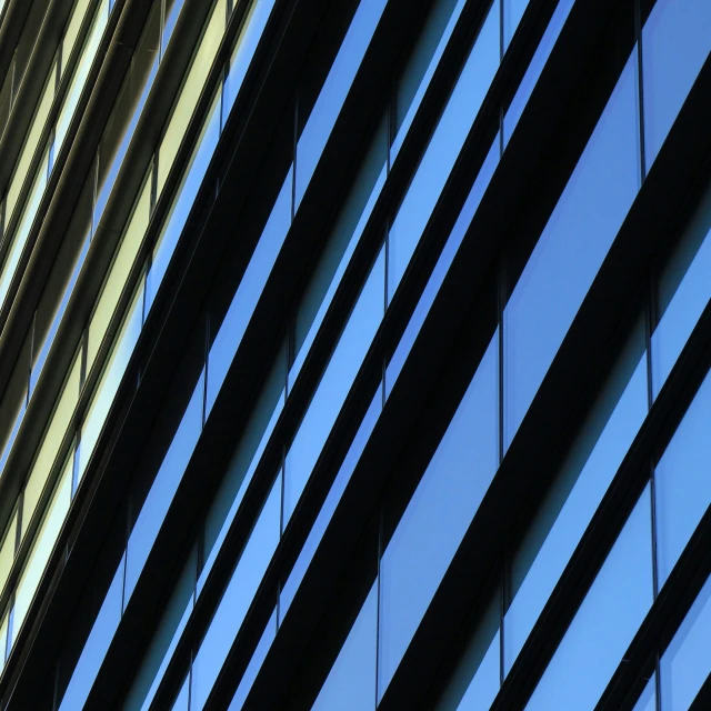 the back end of an office building with a bird hanging on its roof