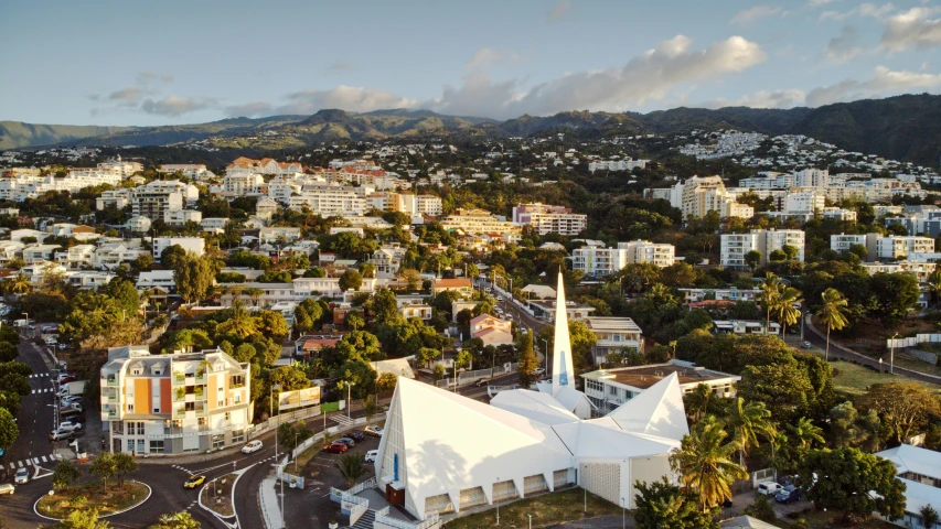 an aerial view of a city with mountains