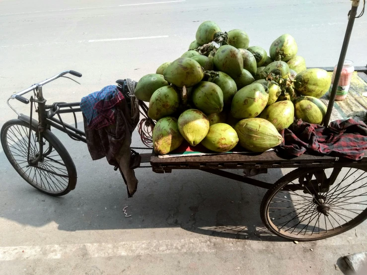 this is a truck filled with fruits sitting on the street