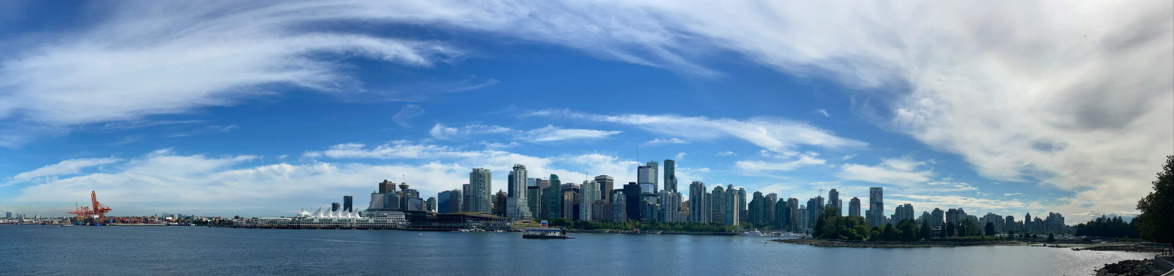 the skyline of a city is overlooking the ocean