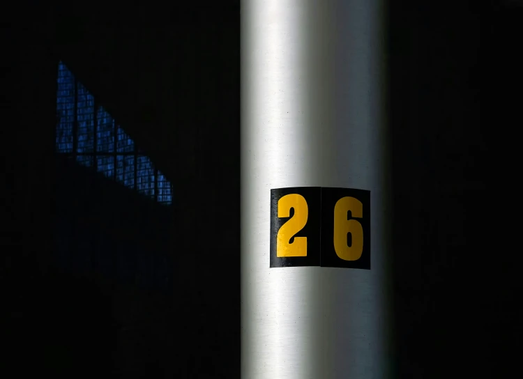 a number on the side of a building with yellow numbers