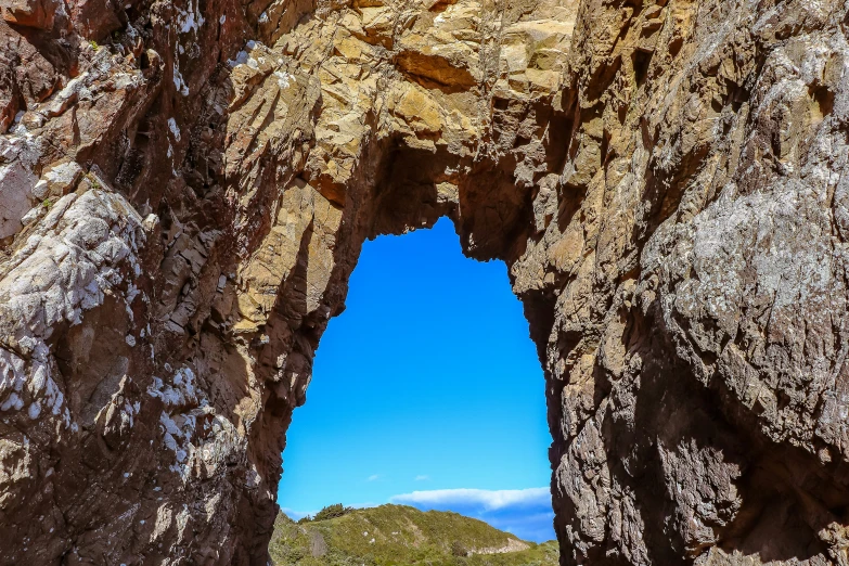 a very large arch shaped by some big rocks