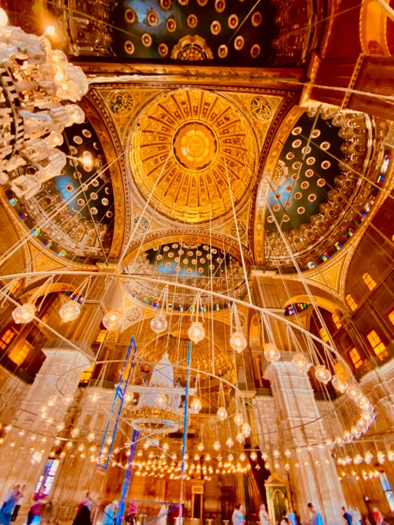 several lamps on the ceiling in a church