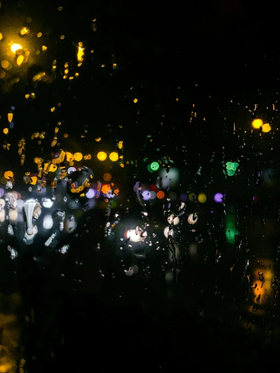 an image of a blurry po of people and street lights