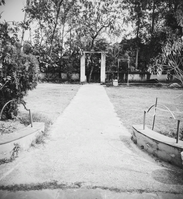 an open walkway leading to a garden