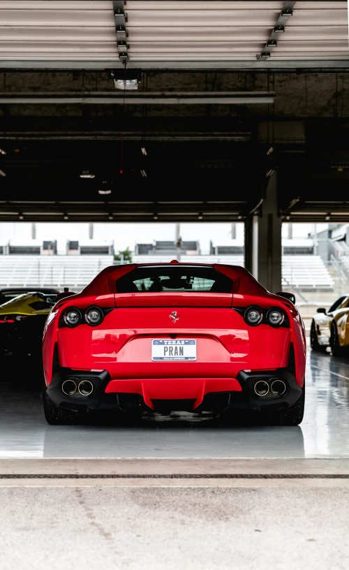 several cars parked next to each other under a building