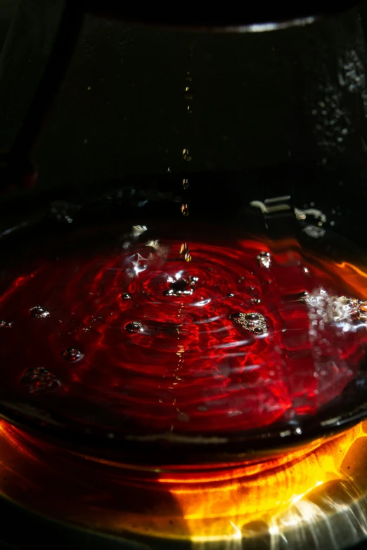 water is boiling from a large pot on the stove