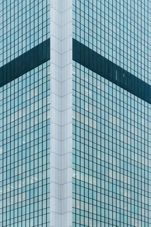 two people walking together across a large building with a clock